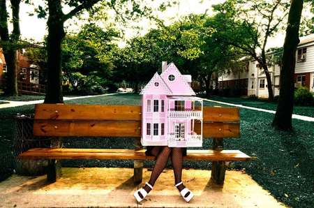 Raven Schlossberg, collage artist, NYC on park bench in Queens, NY.