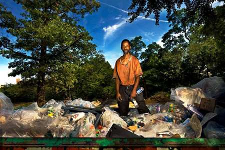 Ernest Phillips earning money in America by collecting bottles from the trash in Central Park, NYC