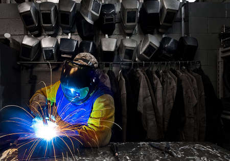 Welder at sheet metal factory