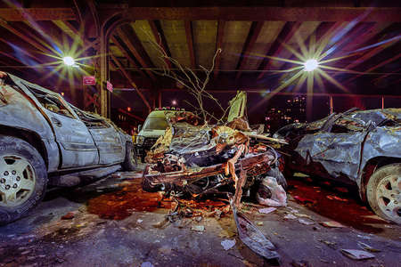 Concrete Landscapes a personal series re-examining what is meant by Landscape Photography.. the intersection of nature and man in an urban environment.  Car damaged from a building explosion in Harlem, NYC.